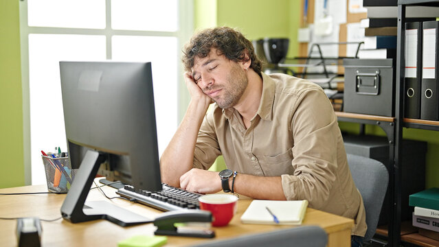 Young Hispanic Man Business Worker Sleeping At Office