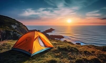 tent set on a top of the cliff on an ocean