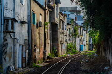 Street - railway.  A small street in Nha Trang in Vietnam with railway tracks running through the residential sector.