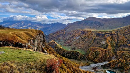 Georgia's landscape, adorned with the Greater Caucasus Mountains, lush valleys,
