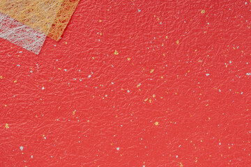 赤いもみ和紙に金銀の柄の背景
