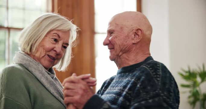 Happy senior couple, dancing and home with love, talking and bonding with care, moving or thinking with memory. Elderly dancer woman, old man and smile for holding hands, retirement or steps in house
