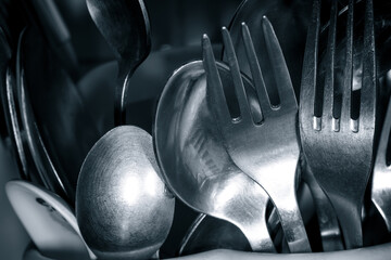 Forks and spoons close-up. Stainless steel cutlery