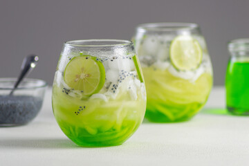 Es Kuwut is a type of Balinese cold cocktail drink made from coconut water mixed with coconut shavings, melon or cucumber shavings, basil seeds, lime juice, melon syrup, ice cubes