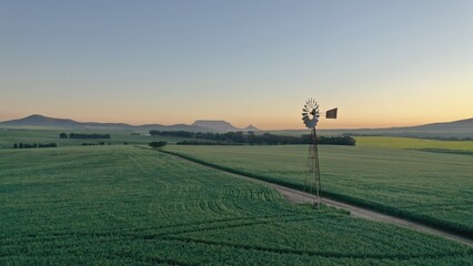 Beautiful sunset in Cape Town South Africa.  Old windmill with Table Mountain in the background....