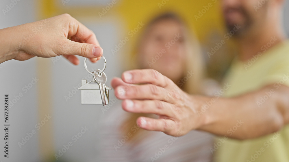 Sticker man and woman couple hugging each other receiving new house keys at new home