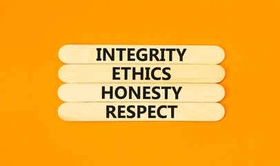 Integrity ethics honesty respect symbol. Concept word Integrity Ethics Honesty Respect on beautiful wooden stick. Beautiful orange table background. Business integrity ethics honesty respect concept.