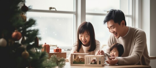 Asian Family celebrating christmas new year and. Home holiday and Christmas tree - obrazy, fototapety, plakaty