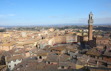 Fototapeta premium tower called Torre del Mangia and panorama of the city of Siena in Tuscany in Italy