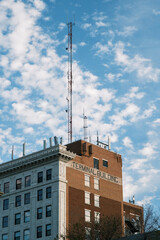 tall cellphone tower on building