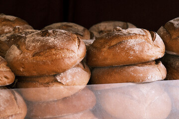 Piles of round breads made in a traditional way.