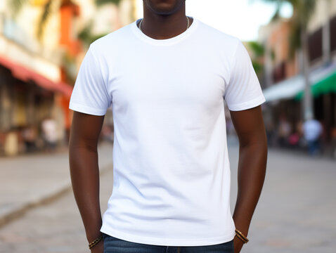 A young black male (African American) model wearing a white t-shirt, no face, mockup, in an outdoor setting,