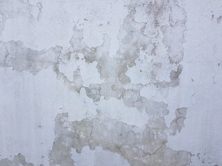 Strange grunge spots on domestic stucco wall background