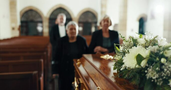 Funeral, church and people with coffin for goodbye, mourning and grief in memorial service. Depression, family and sad senior women with casket in chapel for greeting, loss and burial for death