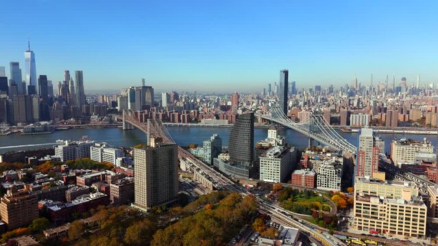 Epic aerial establishing shot of New York. View of river bridges brooklyn manhattan skyscrapers fall foliage 4k 2023