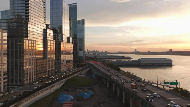 Aerial video New York 9A South to Battery Park. Henry Hudson Parkway sunset