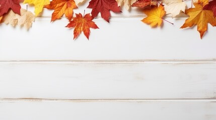 Autumn background with yellow leaves on a white wooden background, with copy space for design.