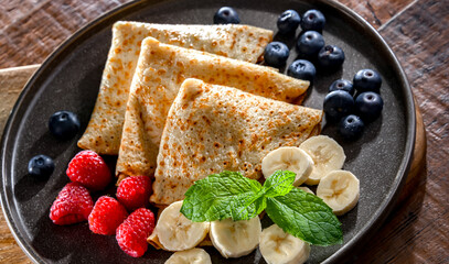 A plate of pancakes filled with sweet cottage cheese