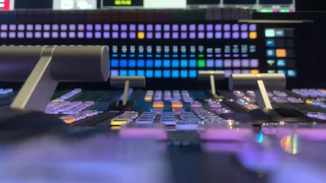 Colorful buttons of the control panel glowing and shining on the blurred background