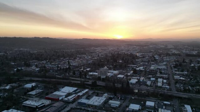 Aerial time lapse of the golden sunset shining over Eugene city in Oregon