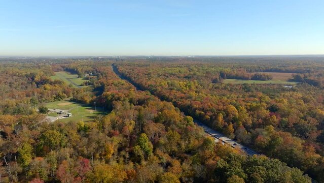 Aerial drone footage Laurel Maryland fall foliage and I95 interstate reveal