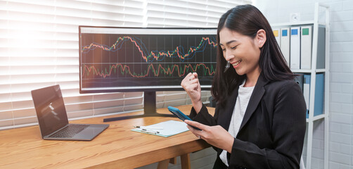 Businesswoman trading foreign exchange market, digital crypto currency exchange market, and stock...