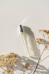 Nature perfume spray on white background, beige and minimalist aesthetic, copy sapce