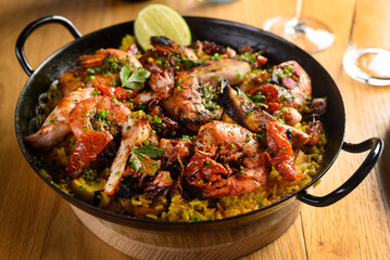 paella with shrimps on black 