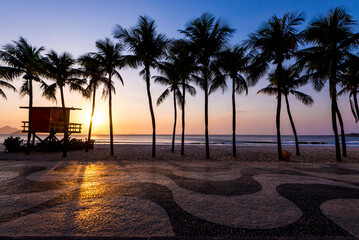Palm Trees and Lifeguard Post in Copacabana Beach on Sunrise and Famous Sidewalk Mosaic