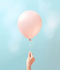 Foto op Canvas Female hand holding a balloon © Lina