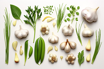 A top-down view of garlic and herbs, removed from a white background.