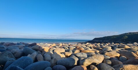 Beautiful scenic rocky beach at Haven Hafan y Mor Holiday Park © Wirestock