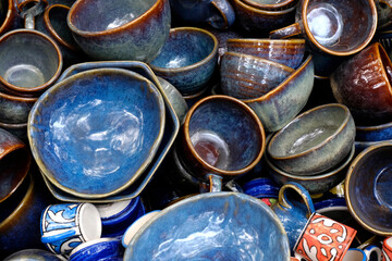 Handmade crockery and serve wares on the sale in the Pune, India, street market. Beautiful ceramic crockery selling in the flee market.