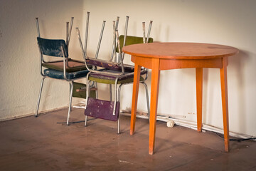 old chairs and a table in a lost place