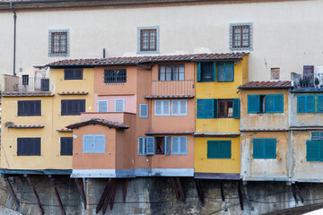 Fototapeta na wymiar Exterior houses and windows on ponte vecchio bridge in Florence, Italy