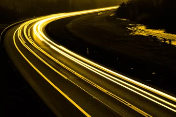 Papier Peint photo Autoroute dans la nuit gold car lights at night. long exposure