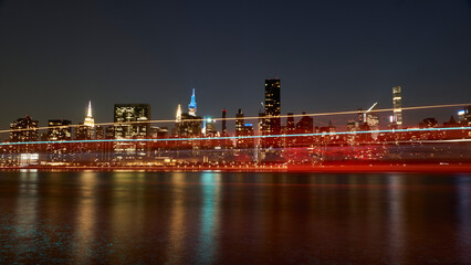 ferry passing by gantry park in front of Manhattan skyline