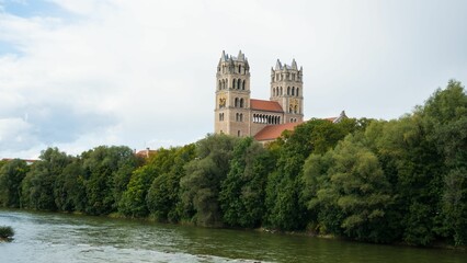 Majestic St. Maximilian in Munich church near the Isar River surrounded by trees