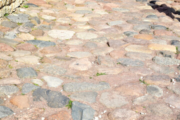 Background from stones of ancient stone pavement