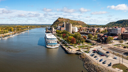 Panoramic aerial view of the town of Red Wing in Minnesota with river cruise boat docked - obrazy, fototapety, plakaty