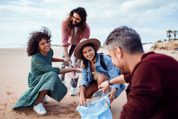 Friends cleaning the beach on vacation