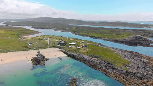 Drone view of Clifden Eco Beach of Camping and Caravanning Park in Ireland on a sunny day