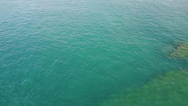 unrecognizable people on jetsky and a few boats