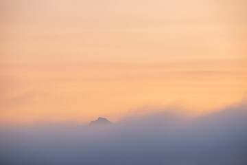 Tip of Mt Pilchuck above the early morning mist in Washington State