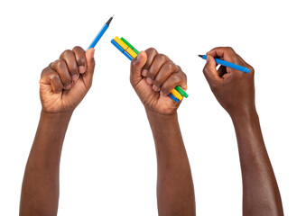 Man holding blue, yellow and green fineliners in hands and writing, drawing, and pointing, isolated...