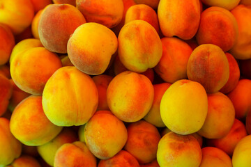 Peaches fresh juicy ripe golden scattering a lot