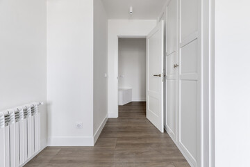 Beautiful room with a contemporary design with a custom-made wardrobe with wooden doors and a...