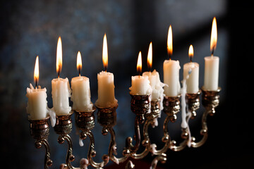 Jewish religious holiday Hanukkah with holiday Hanukkah (traditional candelabra) on a dark background - obrazy, fototapety, plakaty