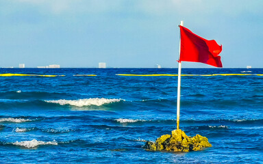 Red flag swimming prohibited high waves Playa del Carmen Mexico.