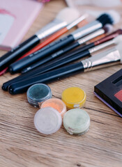 Professional make-up palette. Makeup brushes and eye shadows. Cosmetics for women's make-up. View from above. Concept of products for women's beauty and skin care